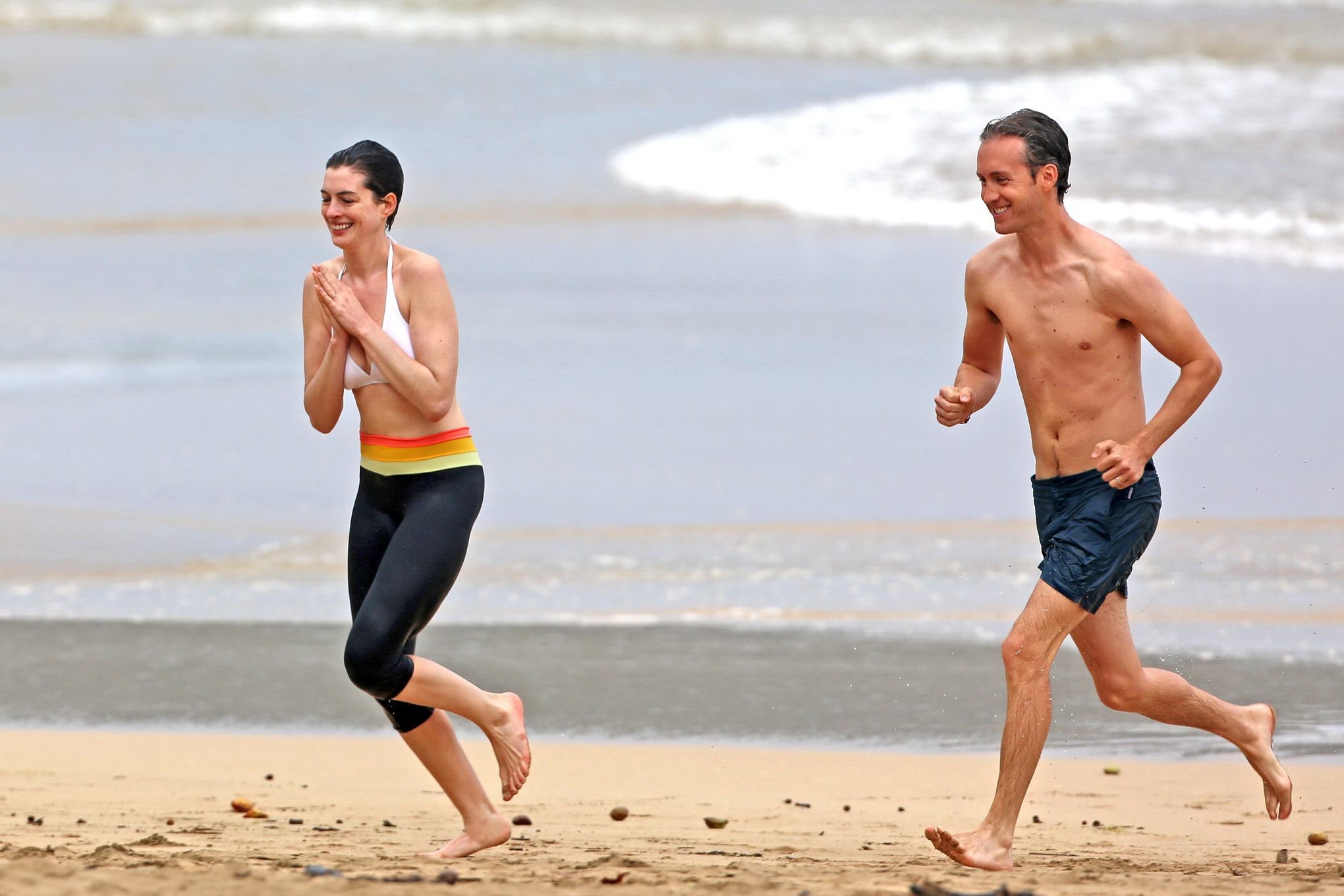 Anne Hathaway showing pokies in wet bikini tops on a Hawaiian beach #75207025