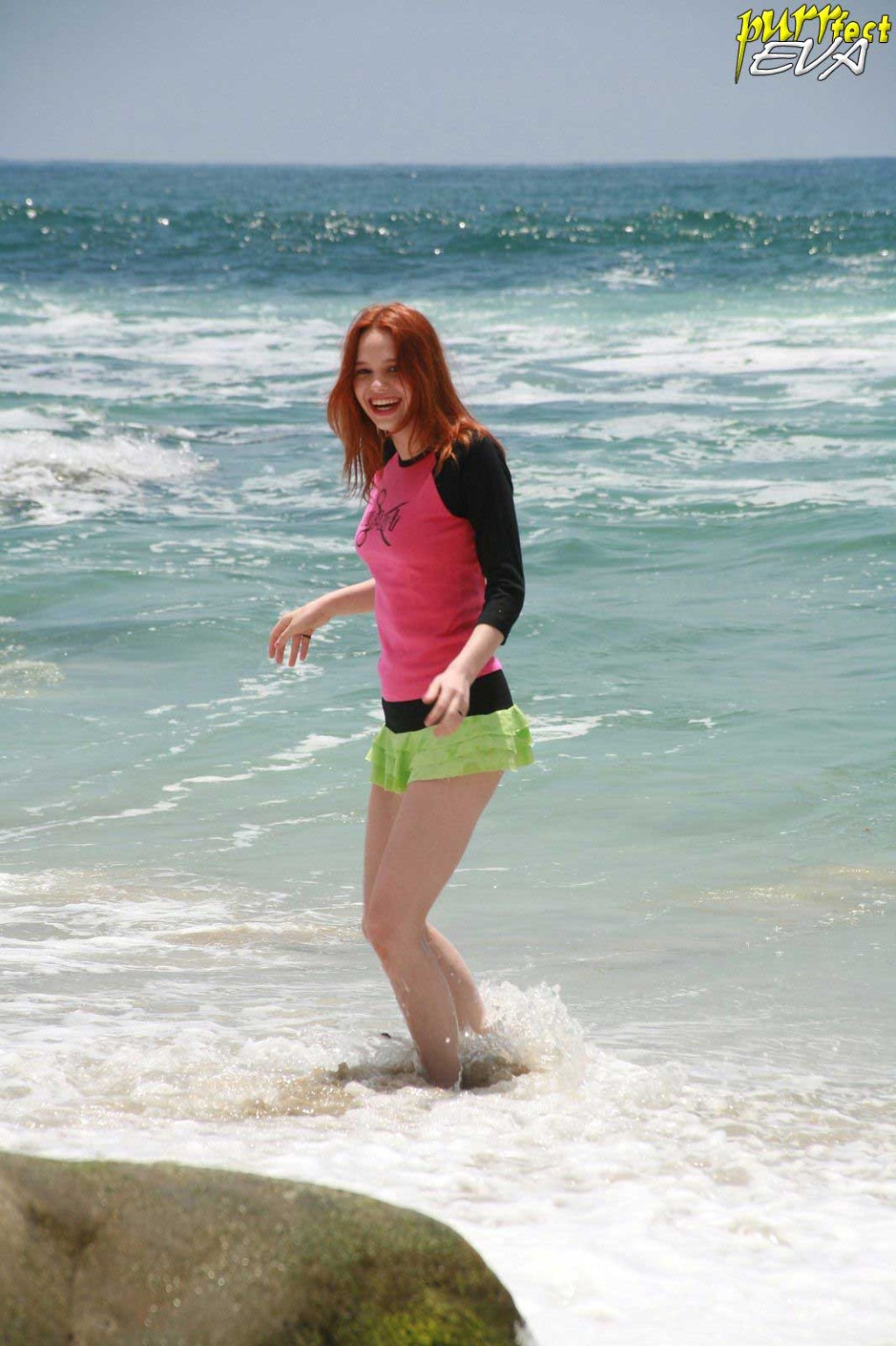 Redhead teen playing at the beach #72319718