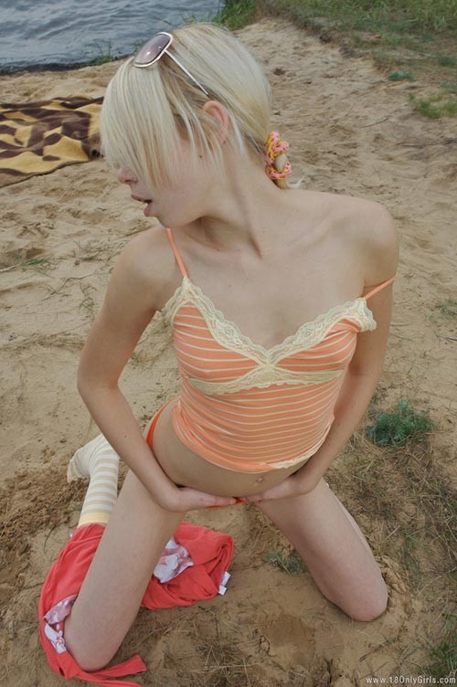 Adorable small titted blonde teenie posing naked on the beach #73903219