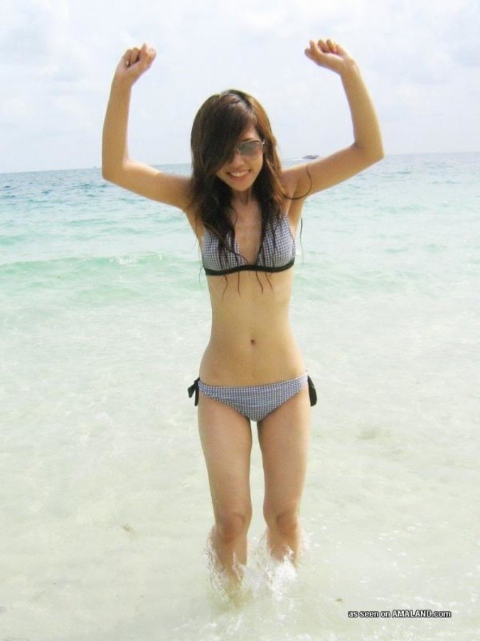 Sexy Asian exgirlfriend posing in a bikini outdoors #67583958