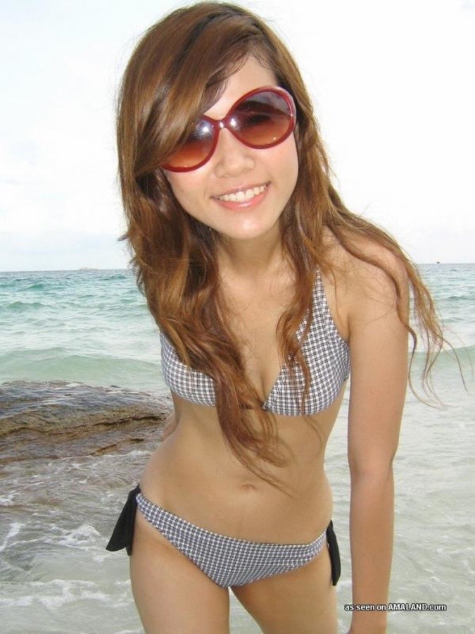 Sexy Asian exgirlfriend posing in a bikini outdoors #67584012