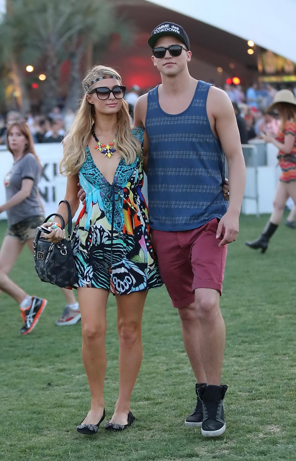 Paris Hilton braless showing huge cleavage in a colorful mini dress at 2013 Coac #75235505
