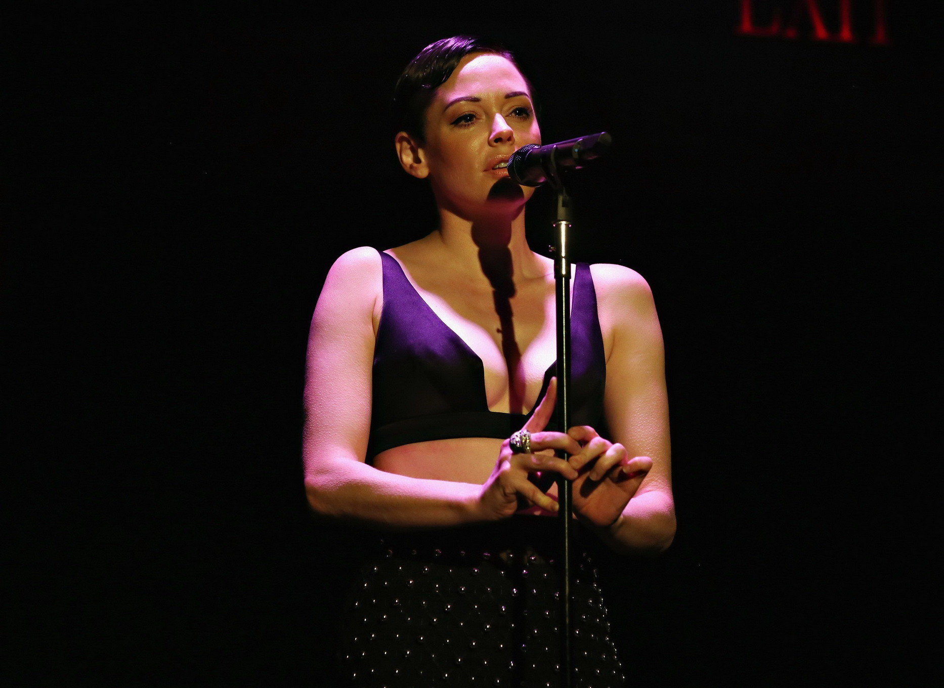 Rose McGowan flaunting her big boobs in skimpy black bra and seethru skirt