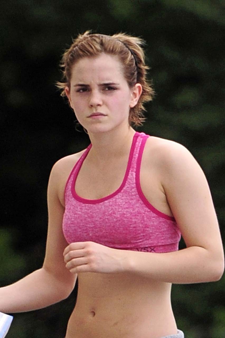Emma Watson exposing sexy body and nice tits in sports bra on street #75302603