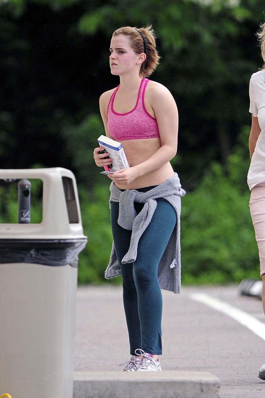 Emma Watson exposing sexy body and nice tits in sports bra on street #75302614
