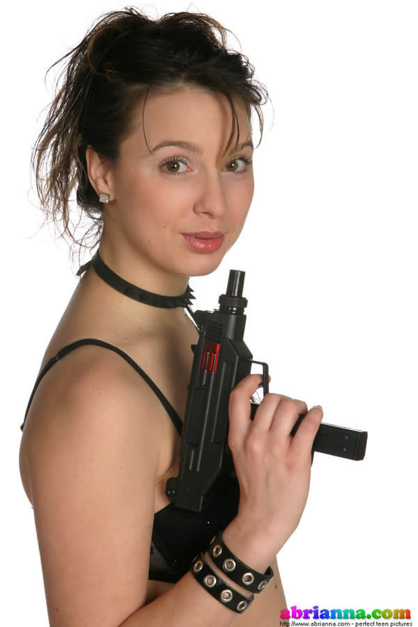 Busty brunette teen posing with guns #75039917