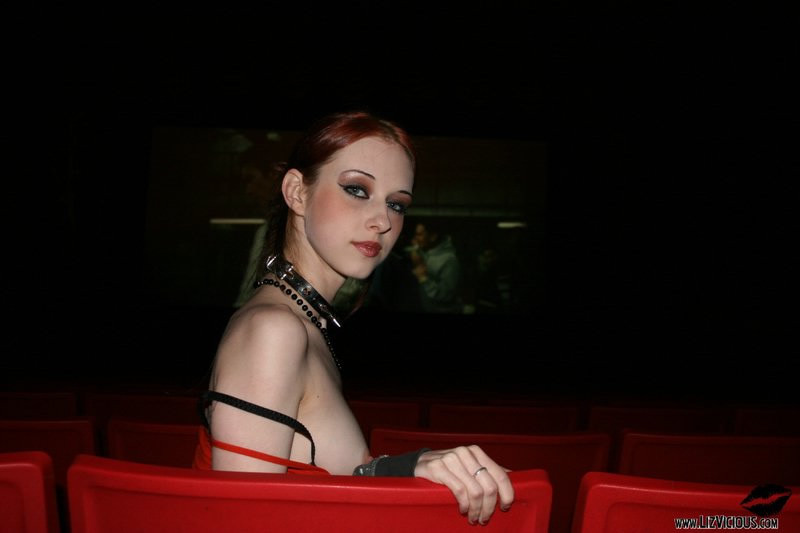 Redhead goth teen strips in the movie theater #76640424
