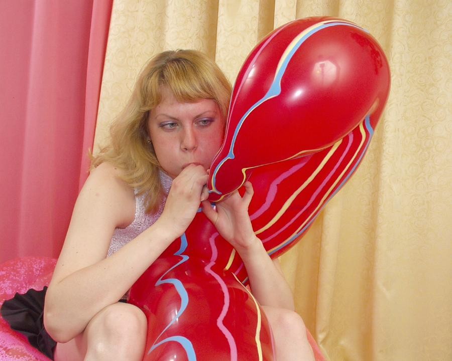 A blonde getting horny by playing with a balloon #76577489
