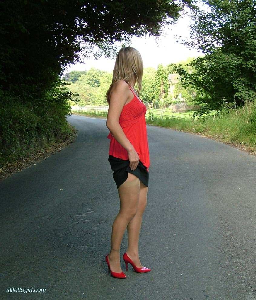 Stiletto girl in stockings and red high heels #72677272
