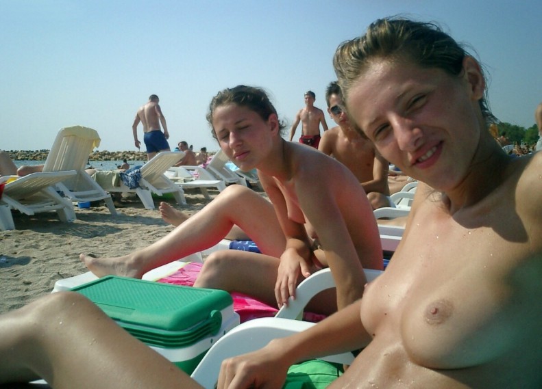 Young nudist shows off her slim body at the beach #72250775