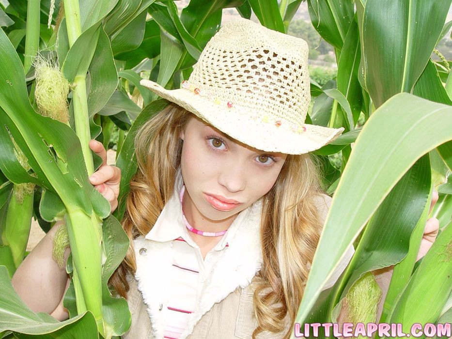 Teen with braces having some fun on a cornfield #68478644