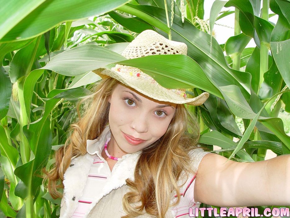 Teen with braces having some fun on a cornfield #68478650