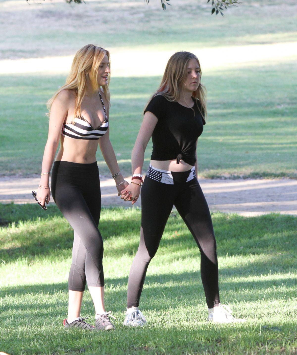 Bella Thorne busty in a striped sports bra and tights #75158379