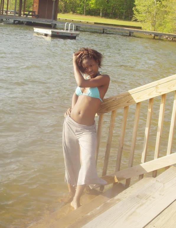 Ebony teen chick flaunts tight body while posing in different ou #67305421