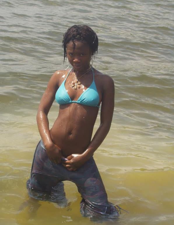 Ebony teen chick flaunts tight body while posing in different ou #67305472
