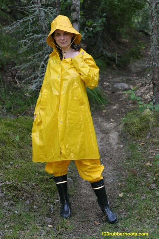 Sexy girl with rubber boots and yellow rainwear #73286038