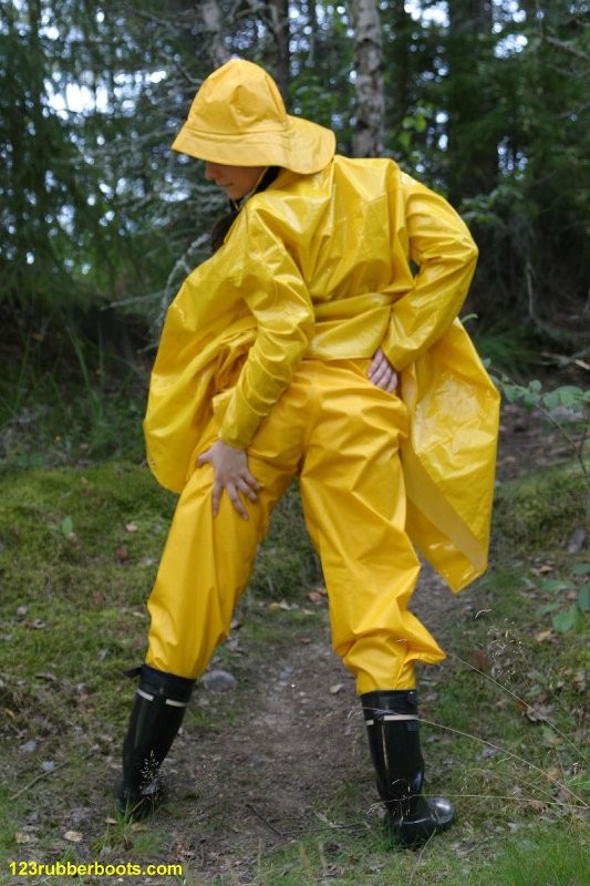 Sexy girl with rubber boots and yellow rainwear #73286082
