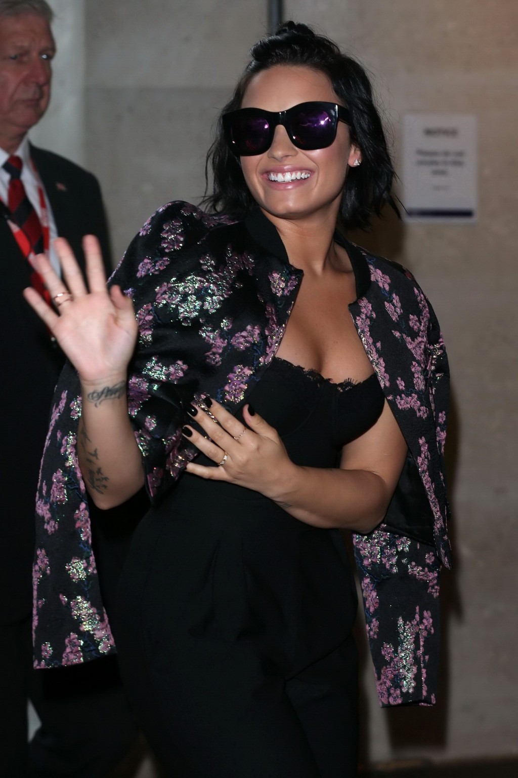 Demi Lovato busty wearing a strapless black jumpsuit