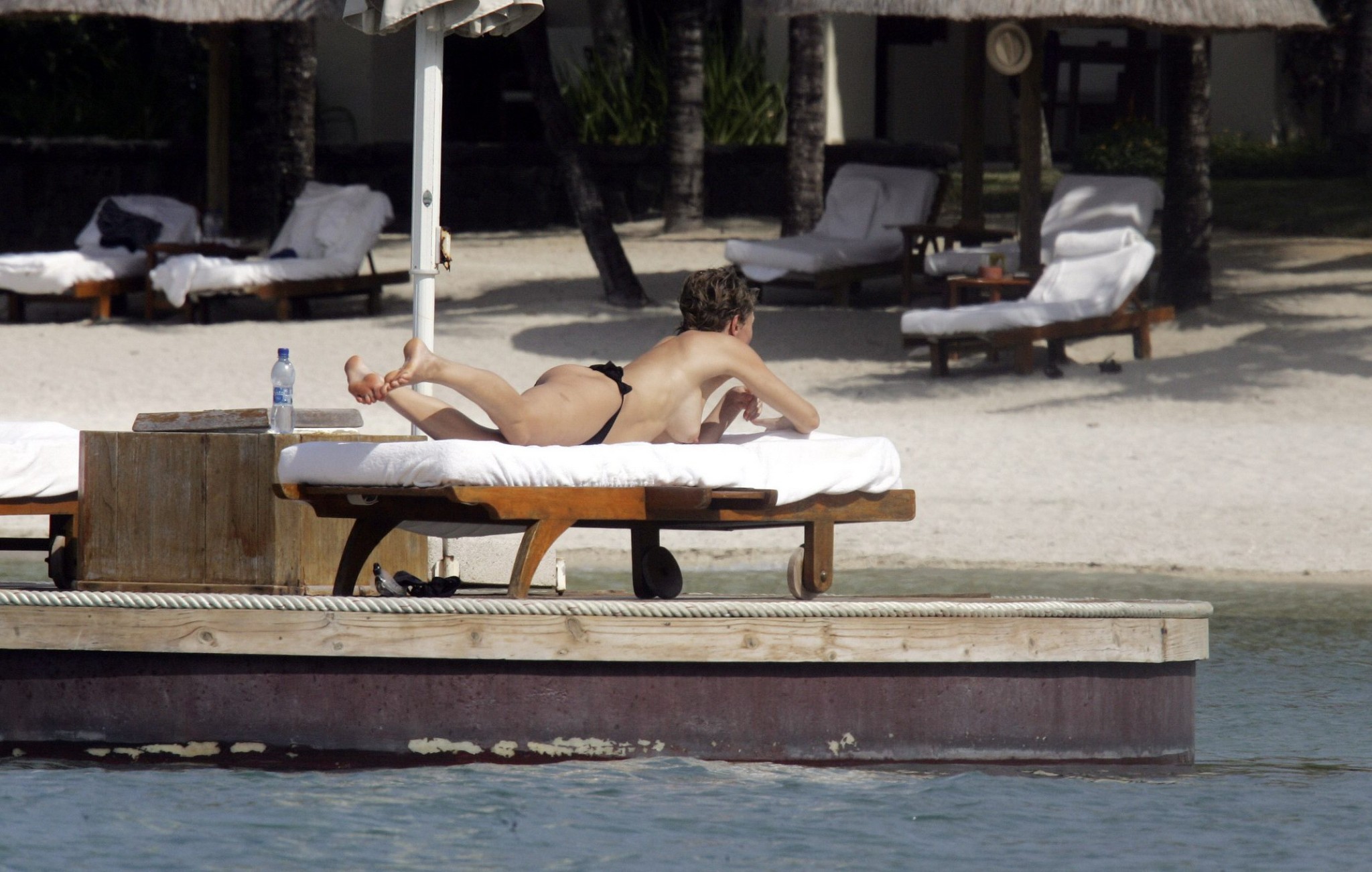 Karen Mulder tanning topless on a beach in Mauritius #75276624