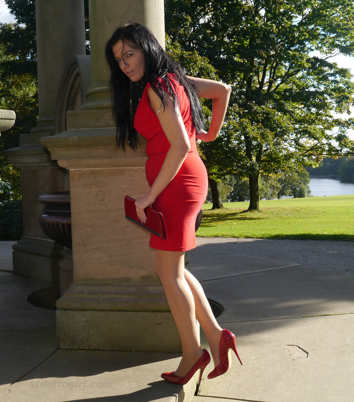 Sexy babe with shoe fetish takes a stroll outdoors wearing a tight red dress wit #74637464
