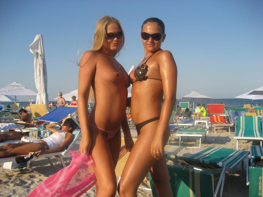 Sexy naked blondes play together at a public beach #72250929