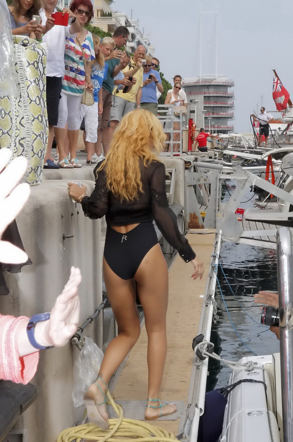Rihanna shows off her round ass wearing black monokini and see-thru shirt out in #75224779