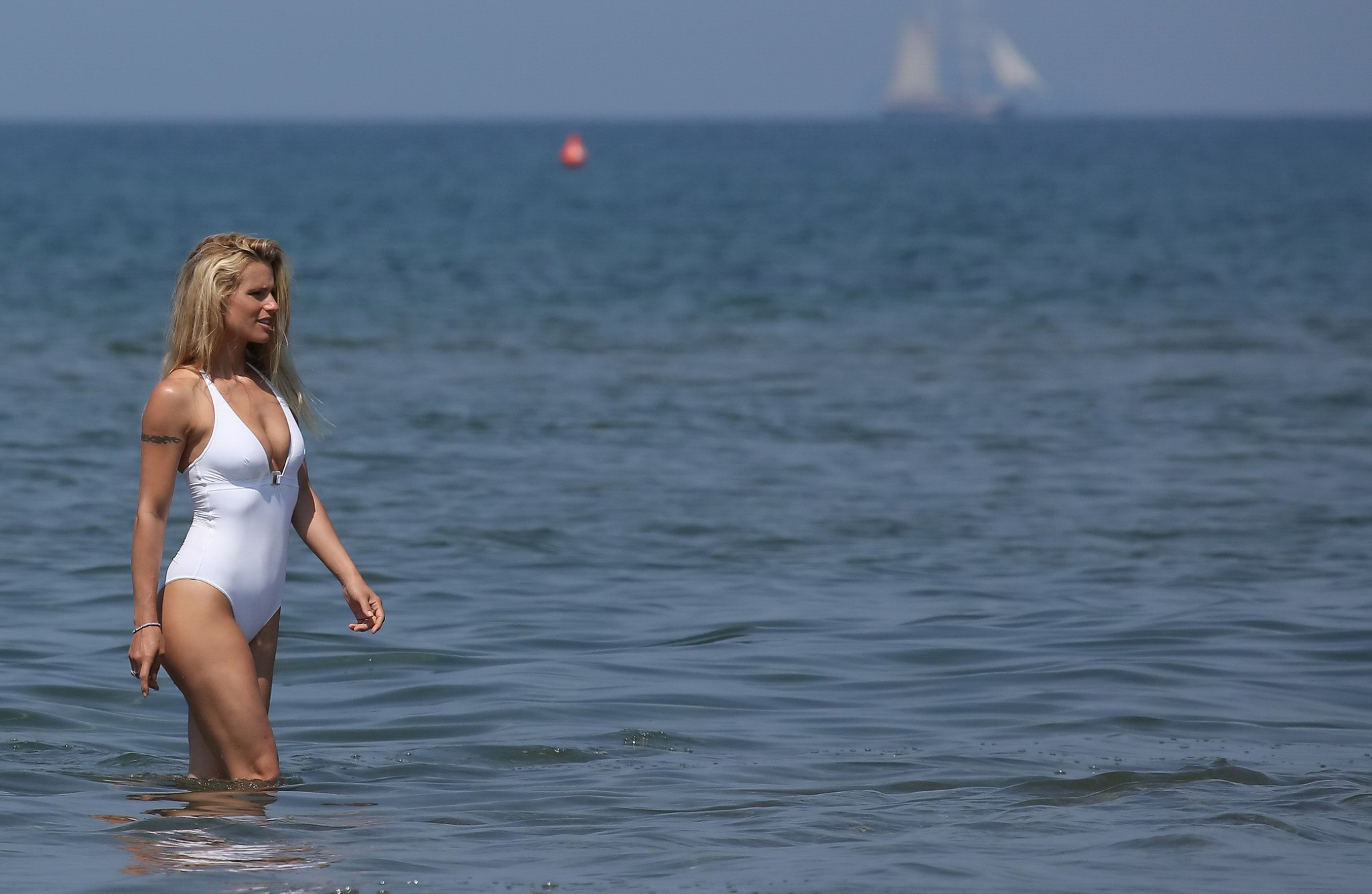 Michelle Hunziker flashing her boobs and pussy in white swimsuit at the beach in #75161344