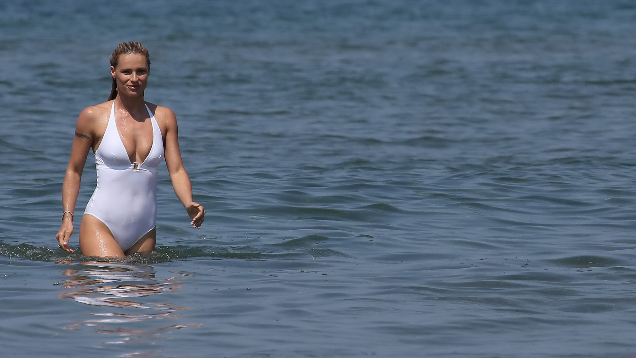 Michelle Hunziker flashing her boobs and pussy in white swimsuit at the beach in #75161368