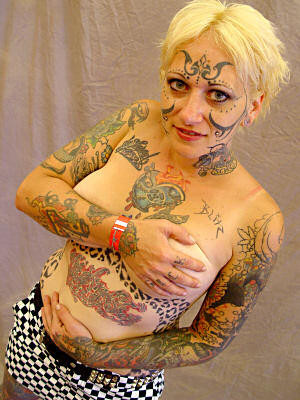 Extreme tattoo and piercing #76495903