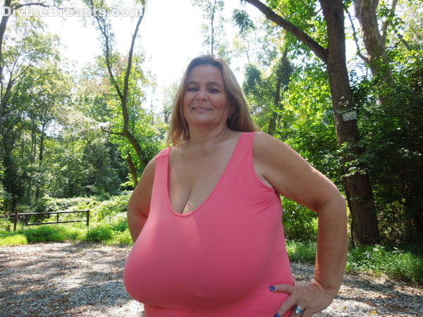 Busty milf amateur flashing her giant breasts outdoors #67448416