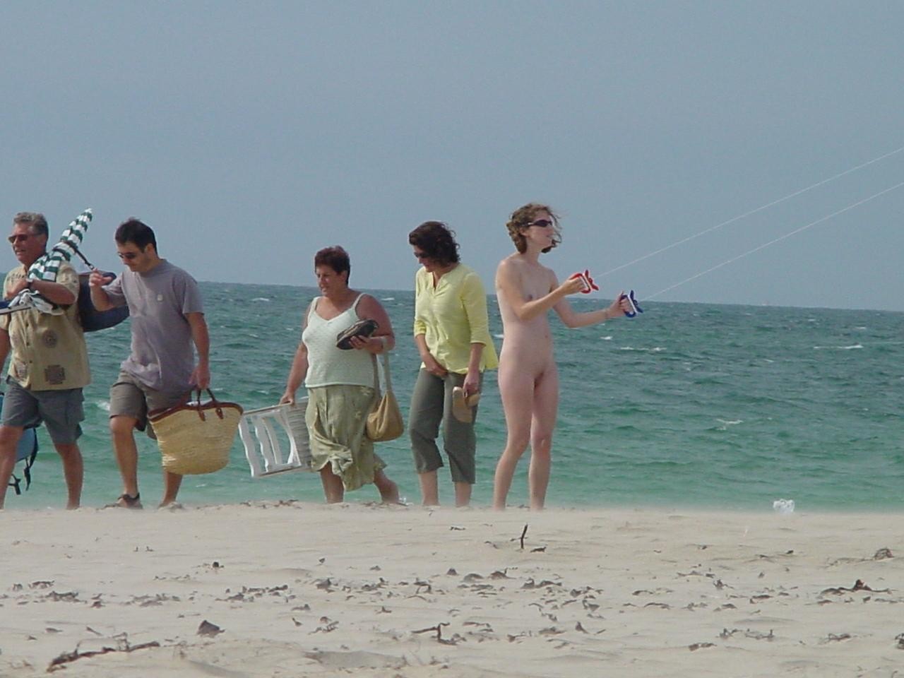 Watch these smooth nudists play at a public beach #72253168