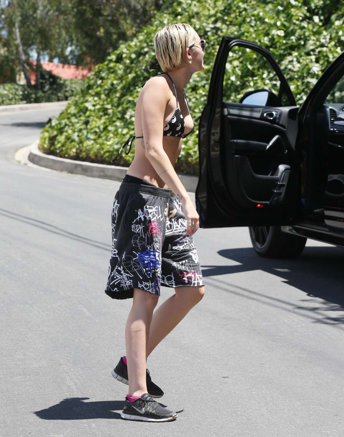 Miley Cyrus busty wearing tiny black bikini top and shorts out in Los Angeles #75165514