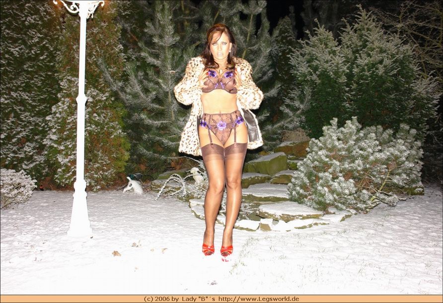 Amateur stockings lady in fur posing outdoor #78523183