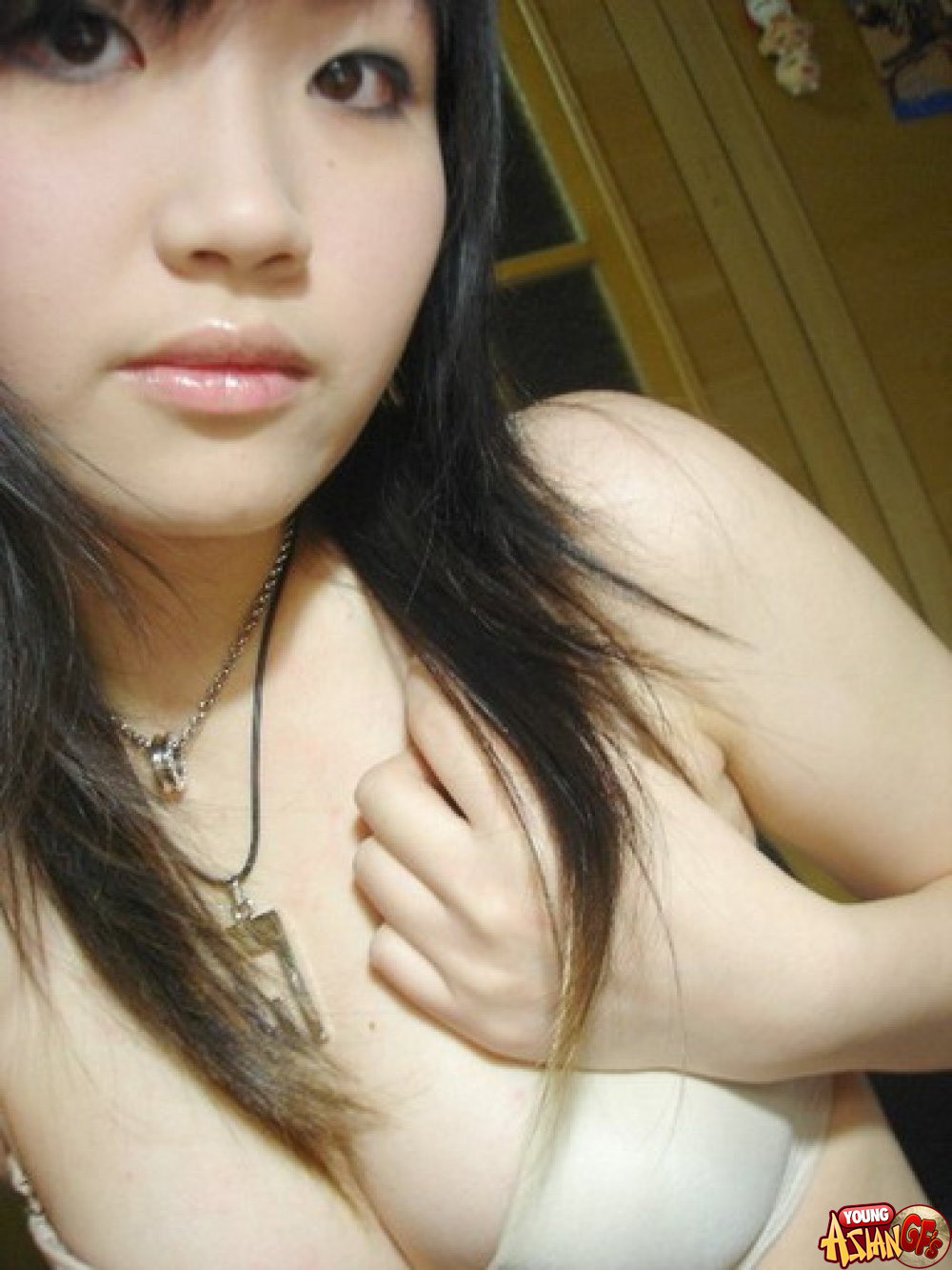 Asian teen girlfriends posing for cell phone pics