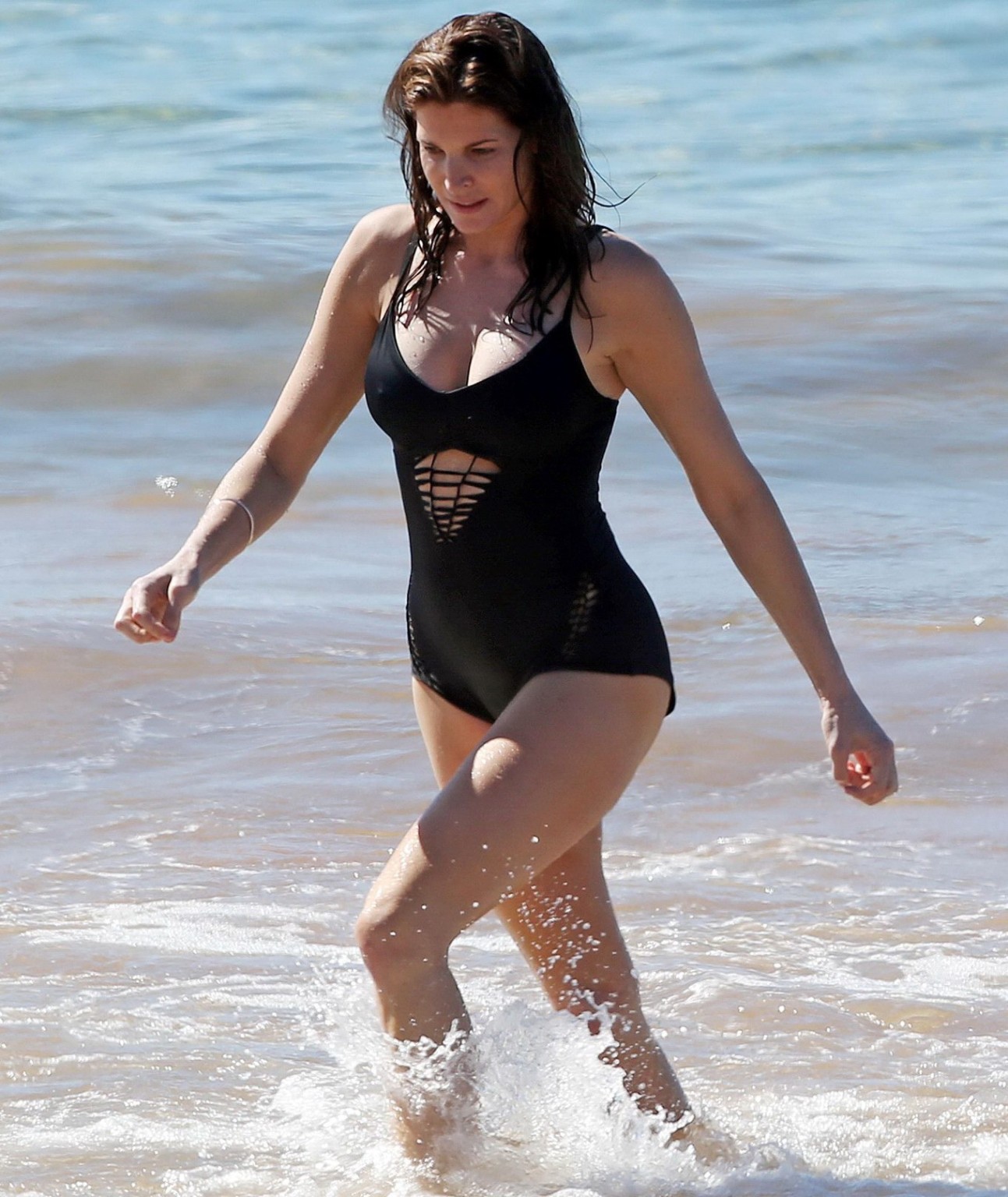 Stephanie Seymour shows off her curvy body wearing a black swimsuit on a Hawaiia #75177064