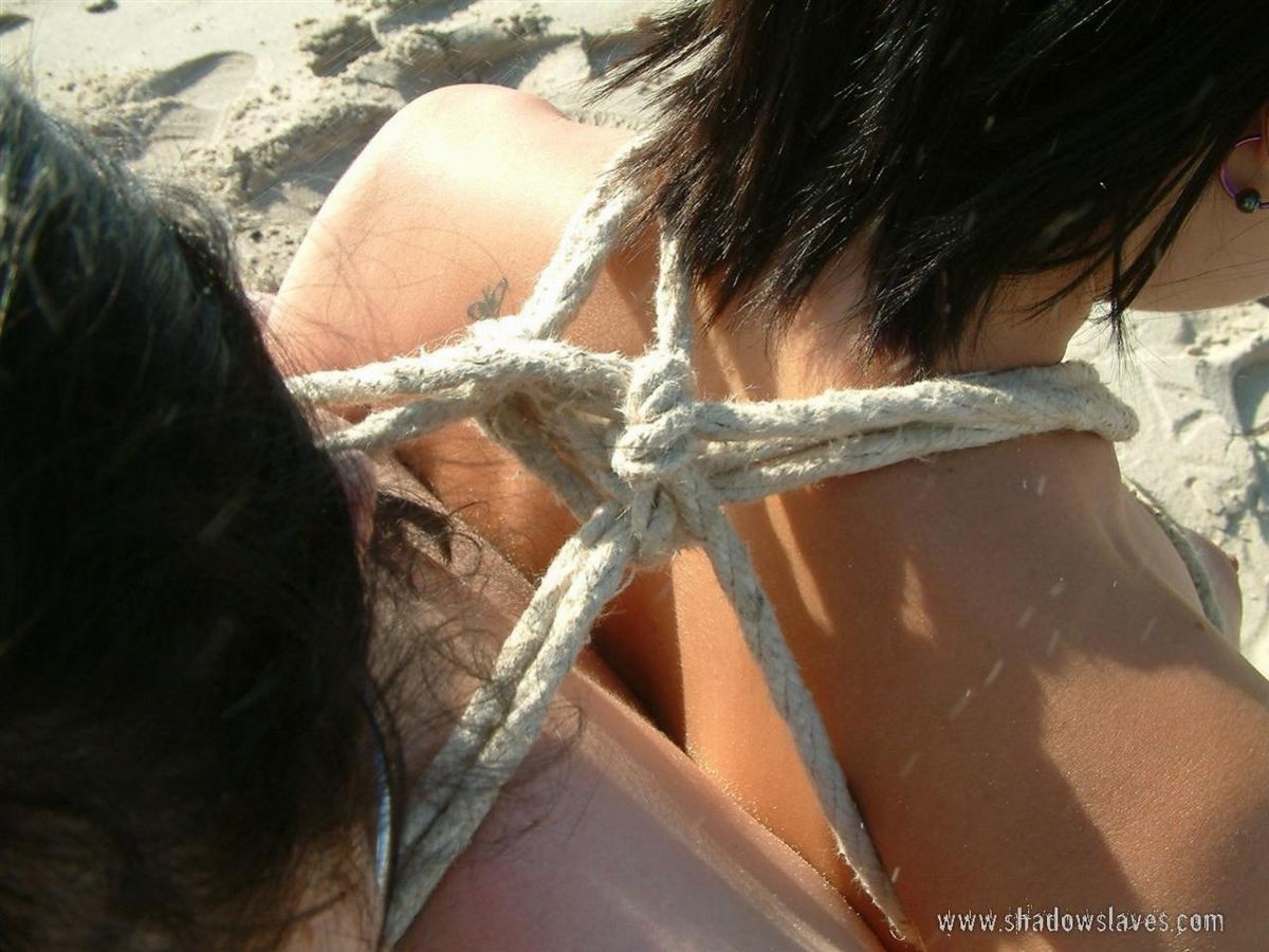 Two slavegirls tied together on the public bondage beach #72170778