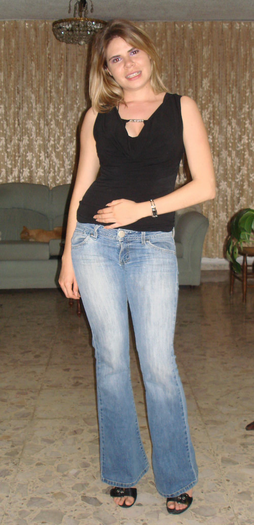 Amateur blonde girl in black lingerie taking off her blue jeans #68183062