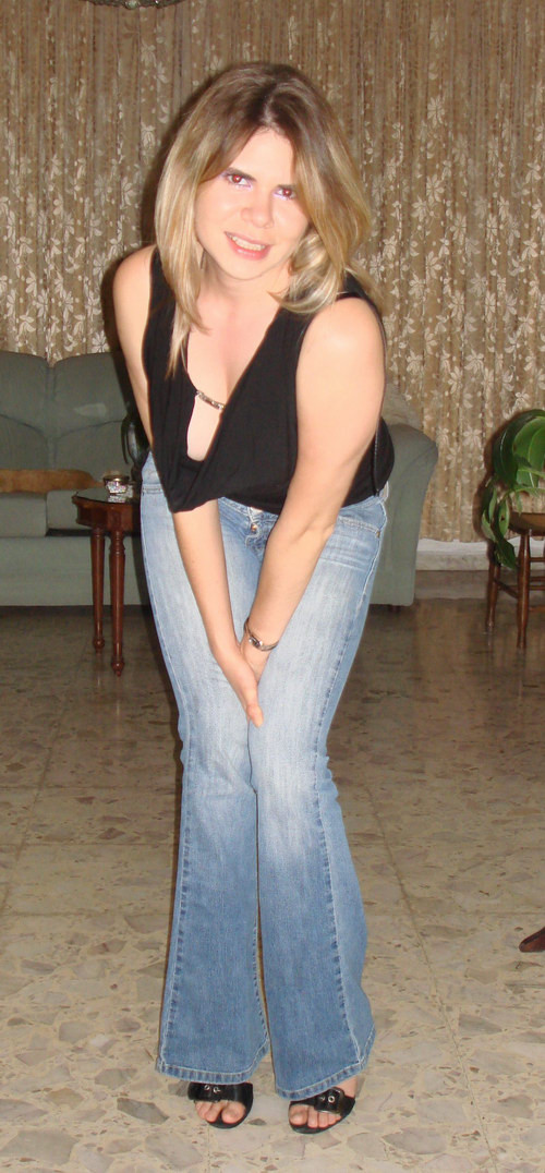 Amateur blonde girl in black lingerie taking off her blue jeans #68183075