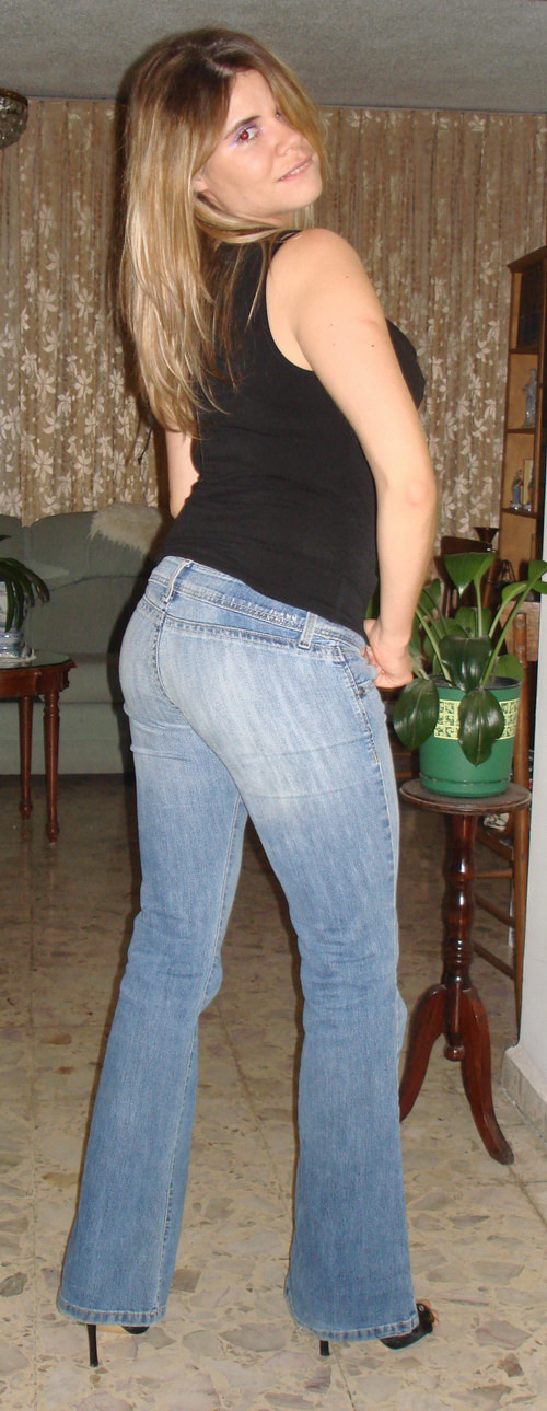Amateur blonde girl in black lingerie taking off her blue jeans #68183086