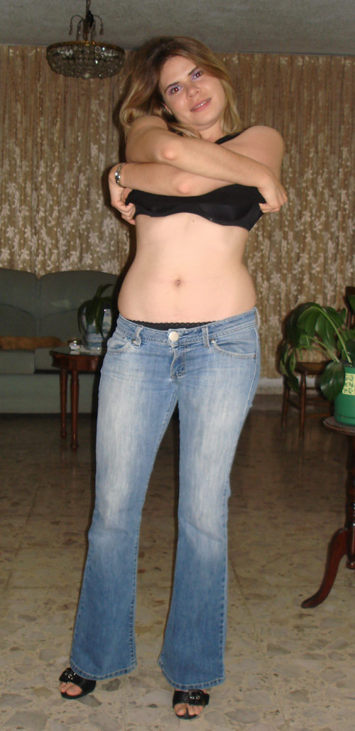 Amateur blonde girl in black lingerie taking off her blue jeans #68183121