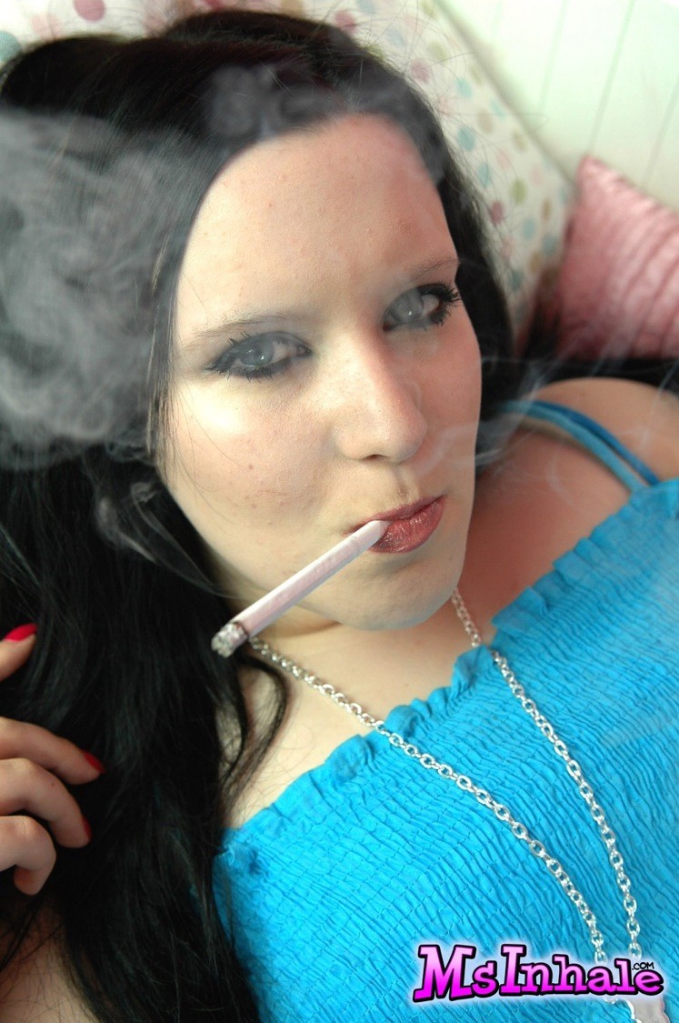 Naughty teen smoker rubs her pussy while she smokes a cigarette  #70263922