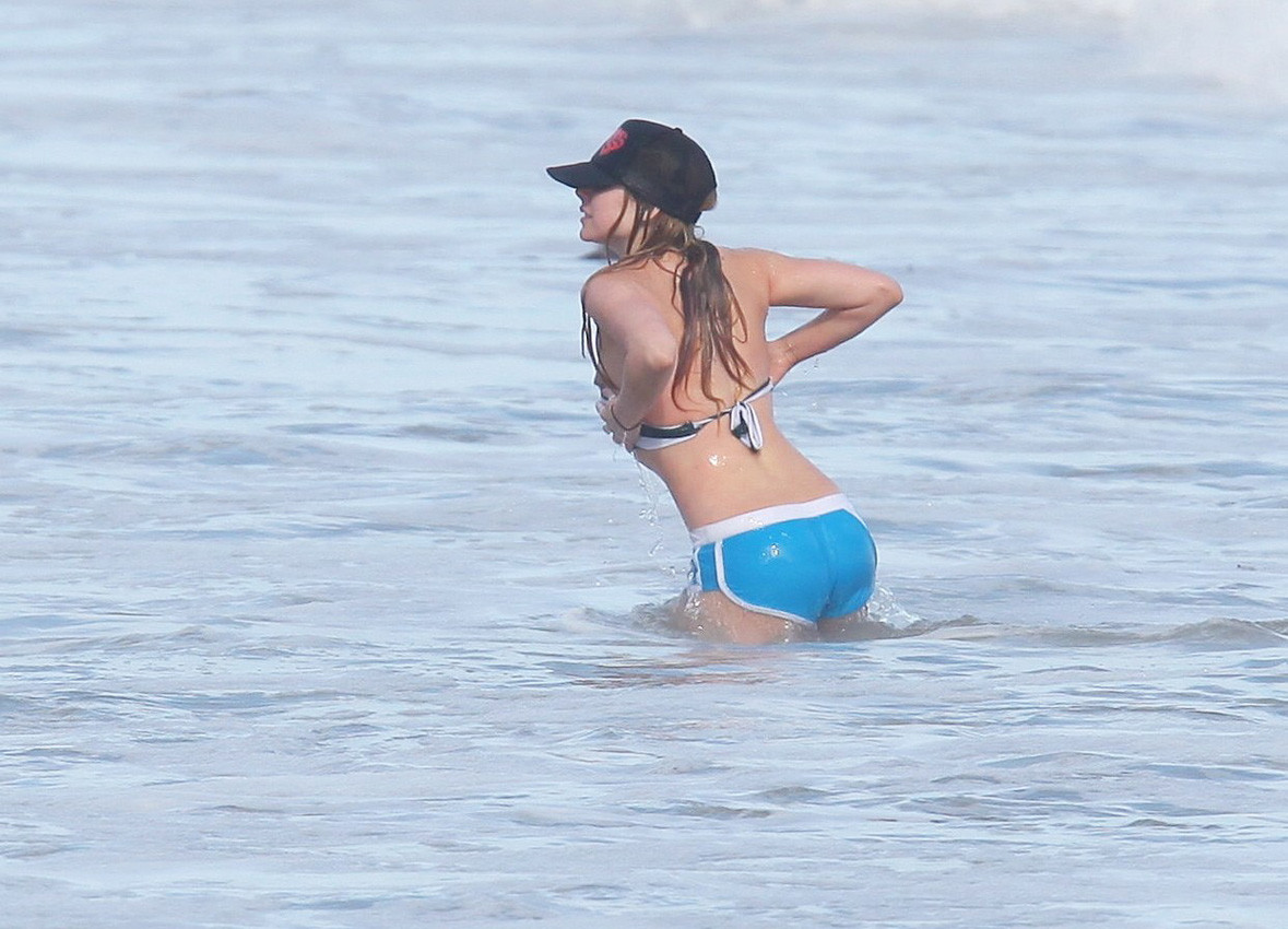 Avril Lavigne slipping her nipple on the beach #75313415