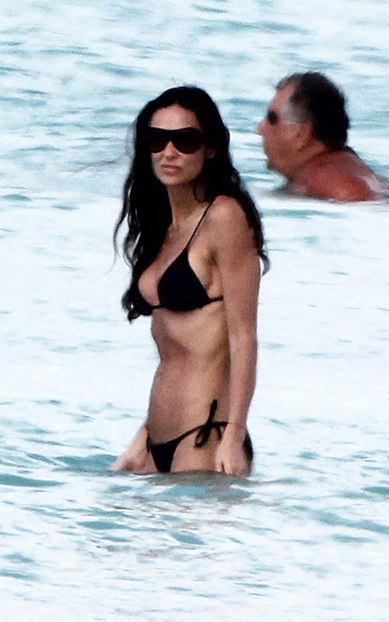 Demi Moore exposing her nice and sexy body in black bikini on beach paparazzi pi #75317222