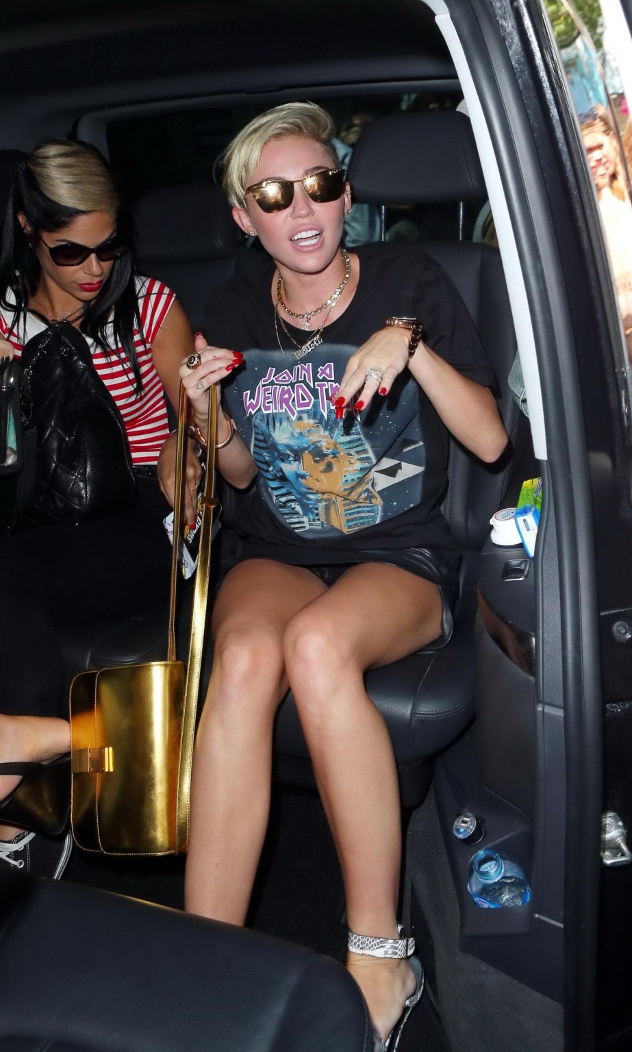 Miley Cyrus flashing her black panties outside the BBC Radio 1 studio in London #75224258