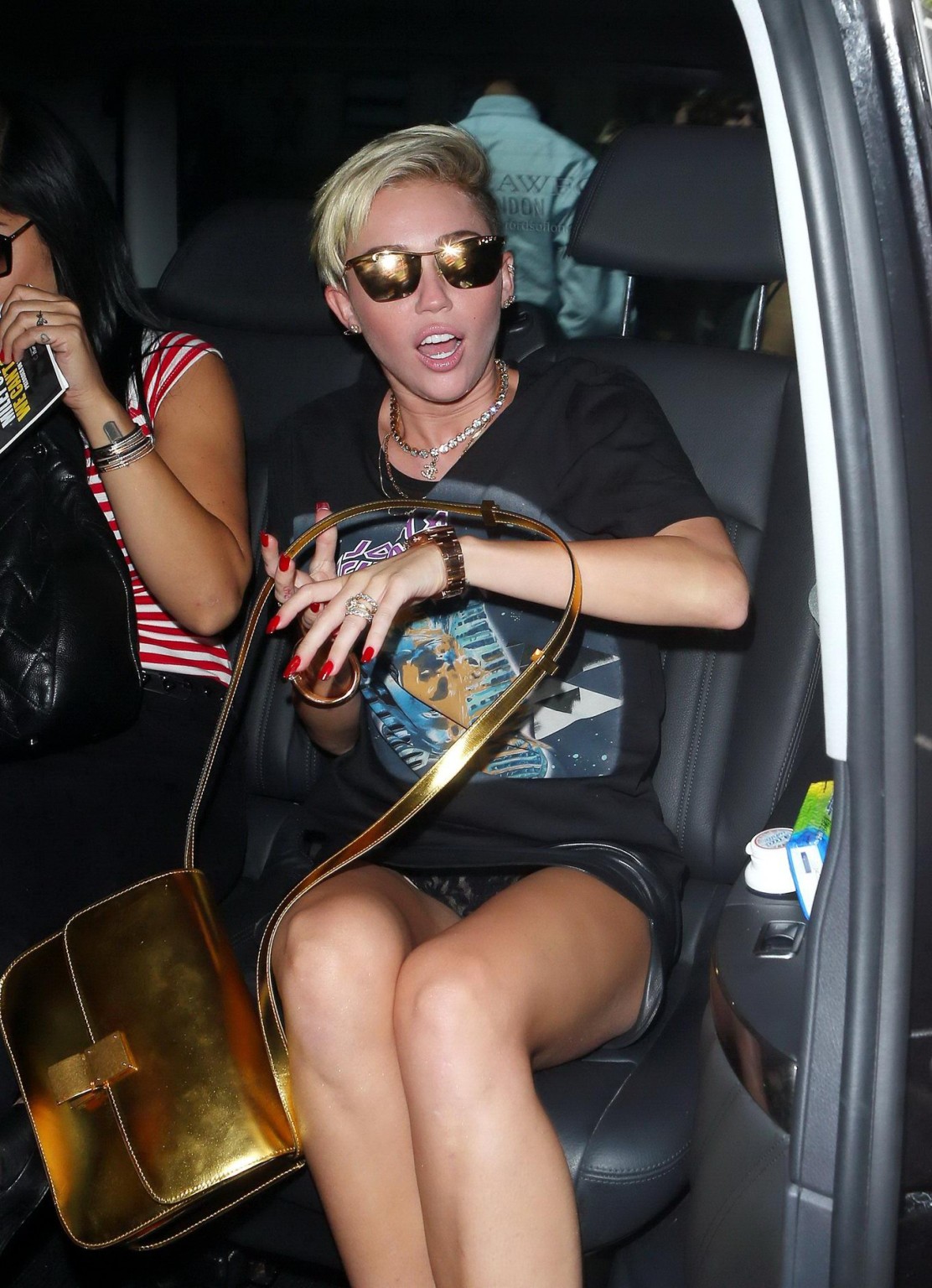 Miley Cyrus flashing her black panties outside the BBC Radio 1 studio in London #75224267
