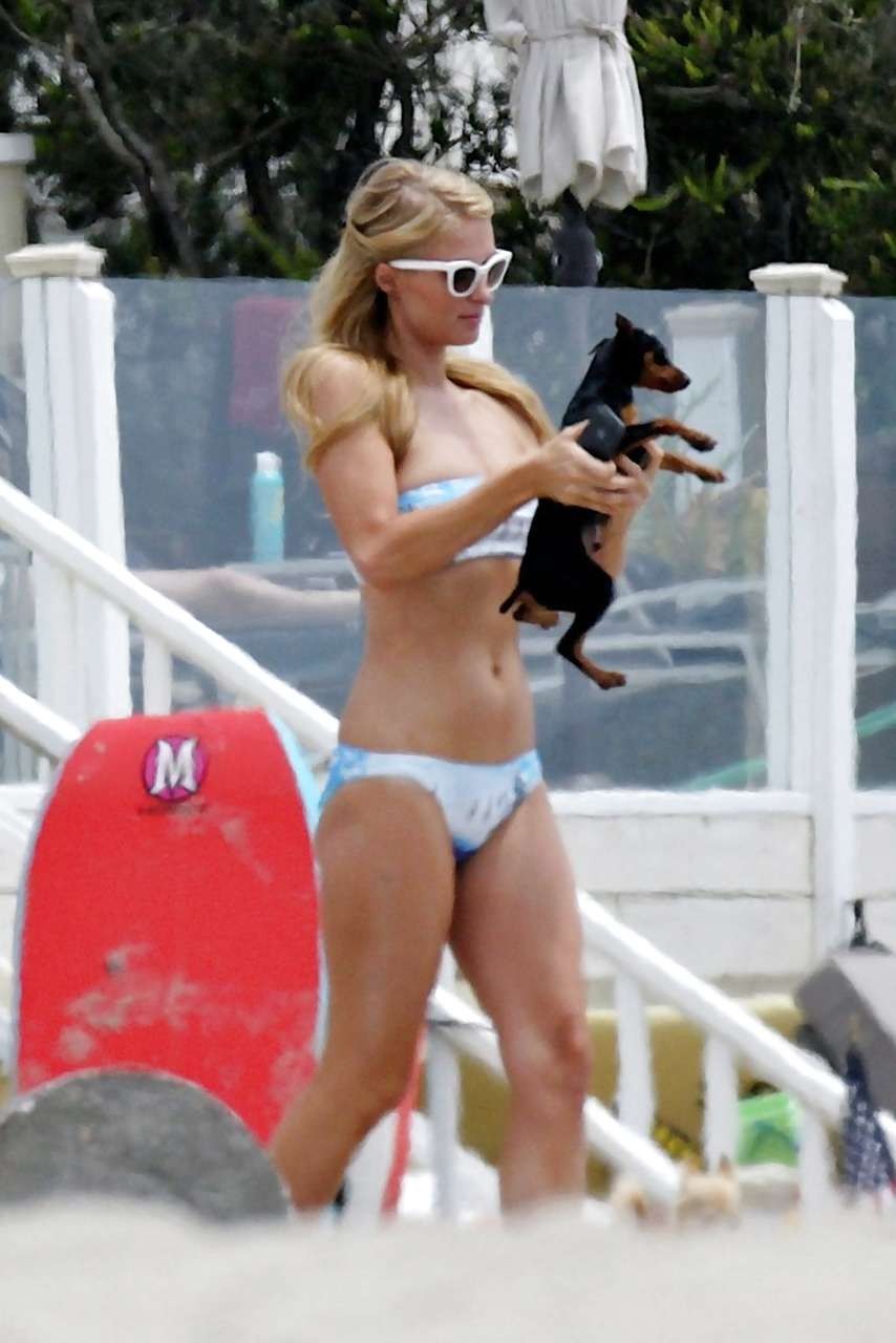 Paris Hilton looking very sexy and hot in bikini on beach