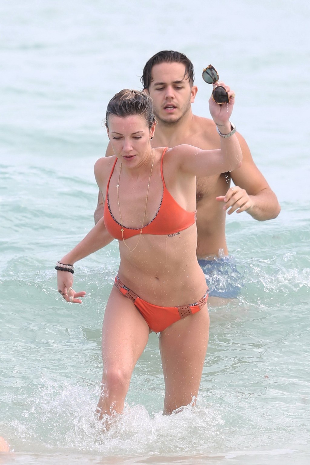 Katie Cassidy showing pokies in a skimpy red bikini #75148366
