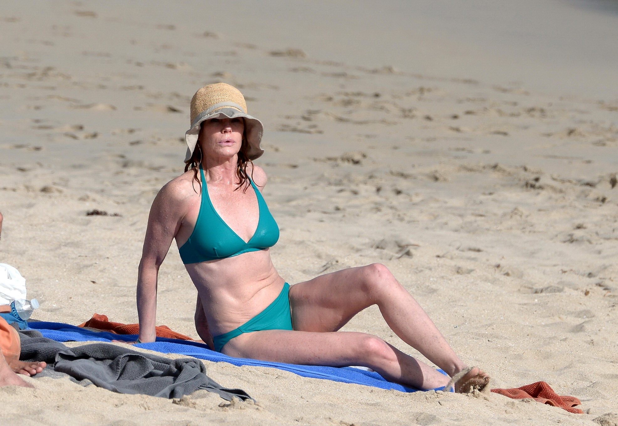 Marg Helgenberger wearing a turquoise bikini on a beach in St.Barts #75208564