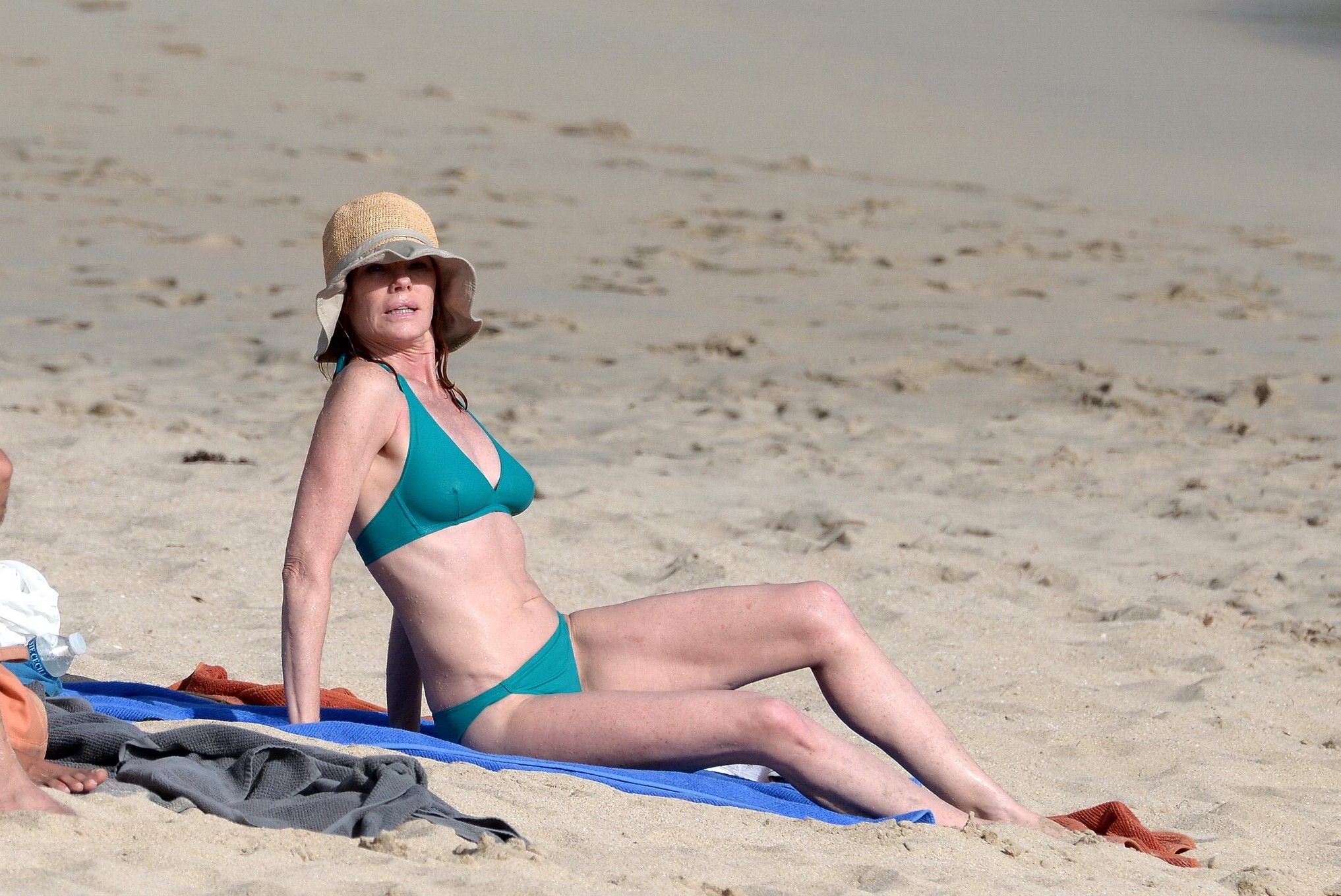 Marg Helgenberger wearing a turquoise bikini on a beach in St.Barts #75208571