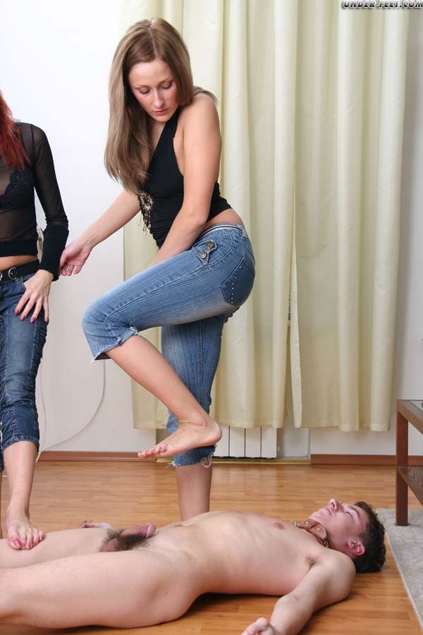 Two bitches in tight jeans trample a freak and use him for an ashtray #71937409